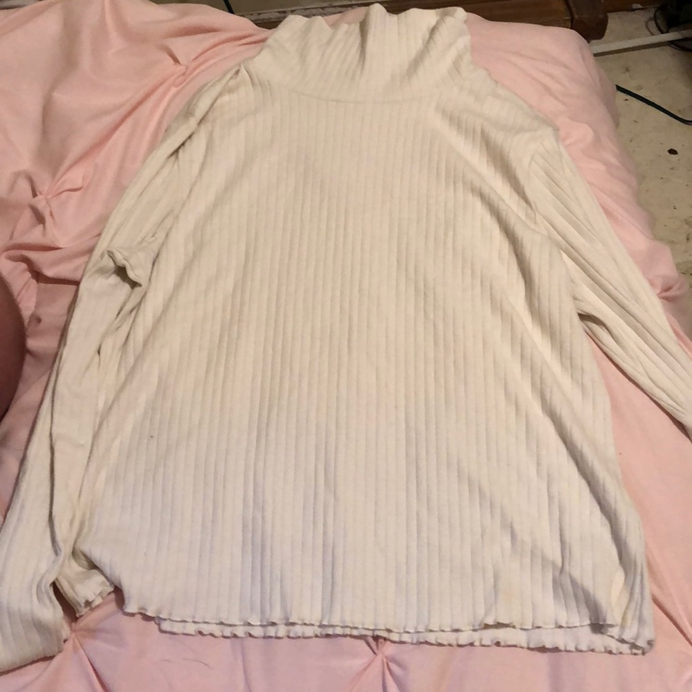 Cream turtle neck with lettuce detailing